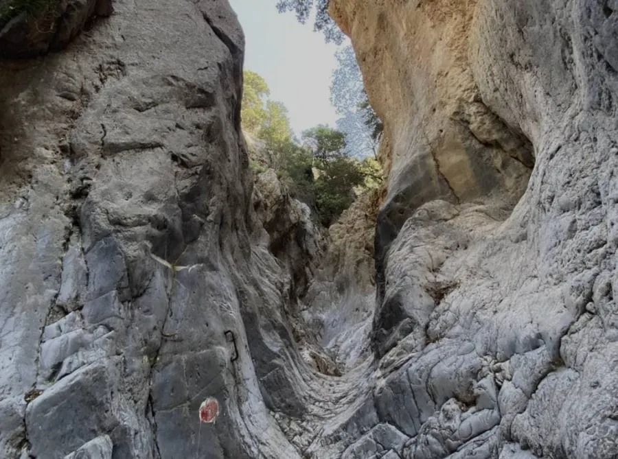 Rocky walls and narrow path inside Kritsa Gorge hiking trail