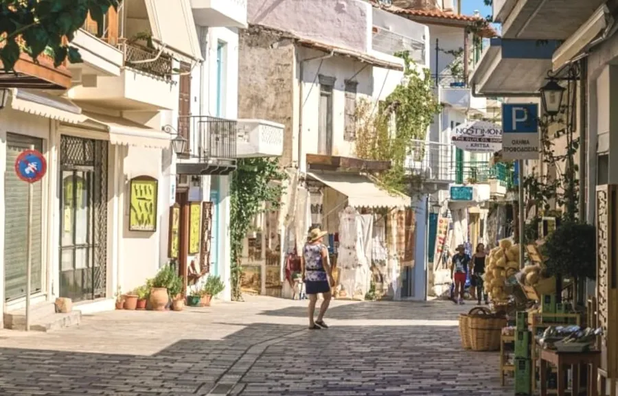 Traditional alley with stone pavement and houses in Kritsa village