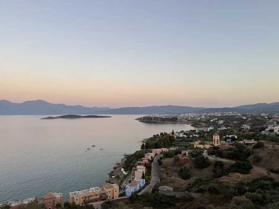 Wide sea view over Mirabello Bay with Agios Nikolaos visible along the coast