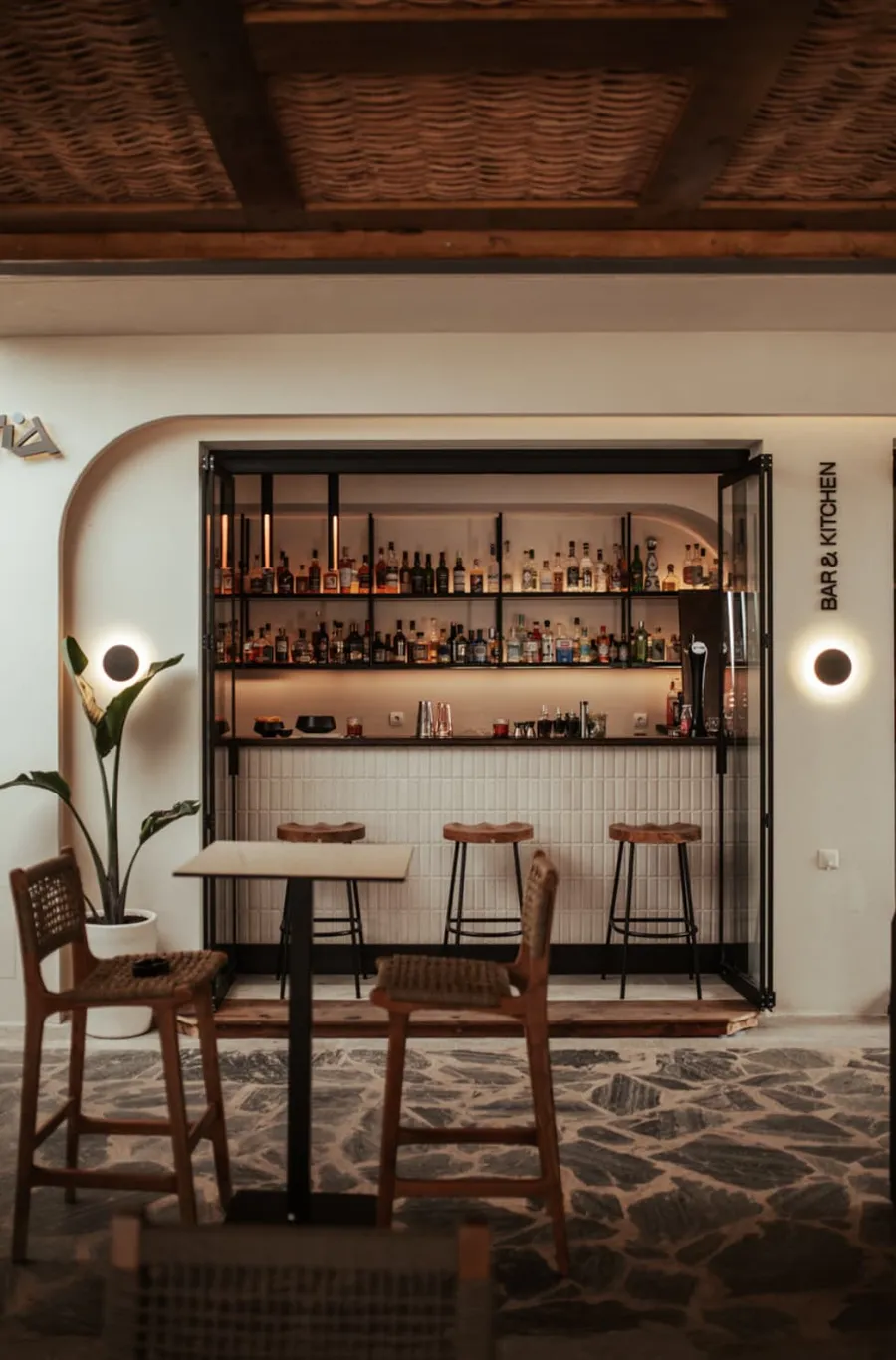 Bar counter and seating area at Estia Bar & Kitchen by the lake