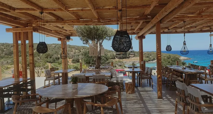 Restaurant tables overlooking the sea at Makrame near Voulisma Beach